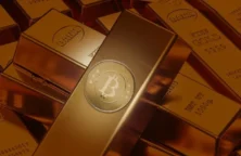 Lingots d'or avec un logo de cryptomonnaie(© Shutterstock)